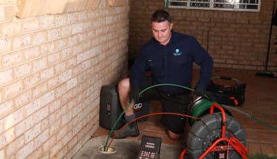 Joseph from The Brisbane Plumbers conducting a CCTV drain inspection at a Brisbane property